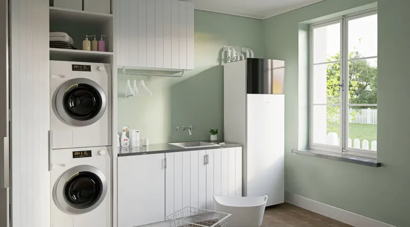 Daikin lucht-waterwarmtepomp met geïntegreerde binnenunit in een wasruimte, productillustratie van de fabrikant